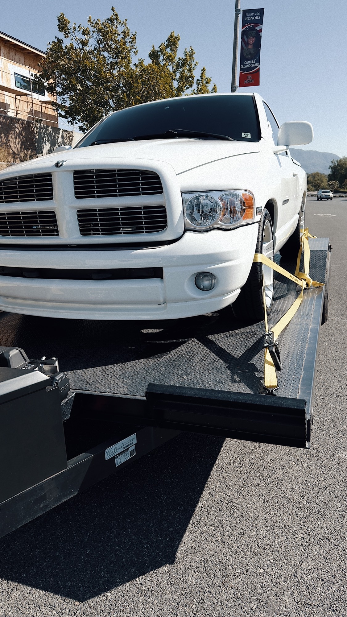 Truck loaded and strapped on the trailer deck