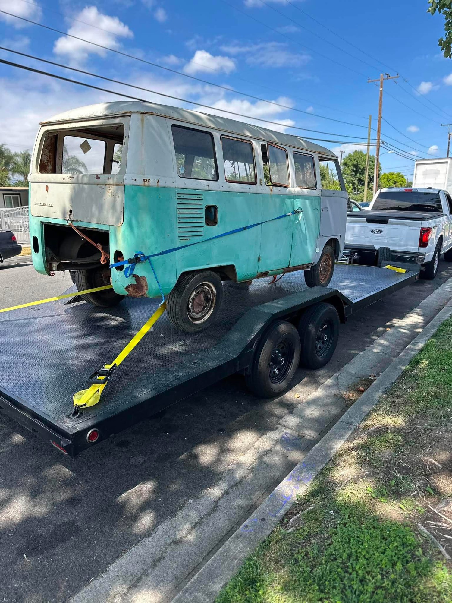 Vintage Volkswagen bus loaded and strapped on the 412 trailer